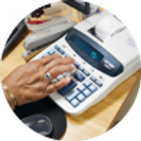 hand typing on calculator