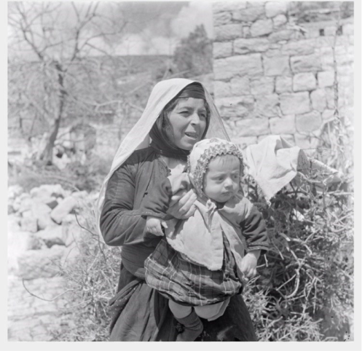 Women in Palestinian dress from Deir al-Qasi in 1937