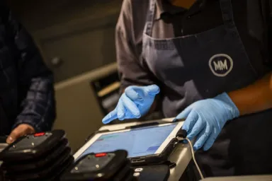 Staff using Dines tablet at Mercato