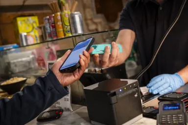 Customer paying at food hall counter
