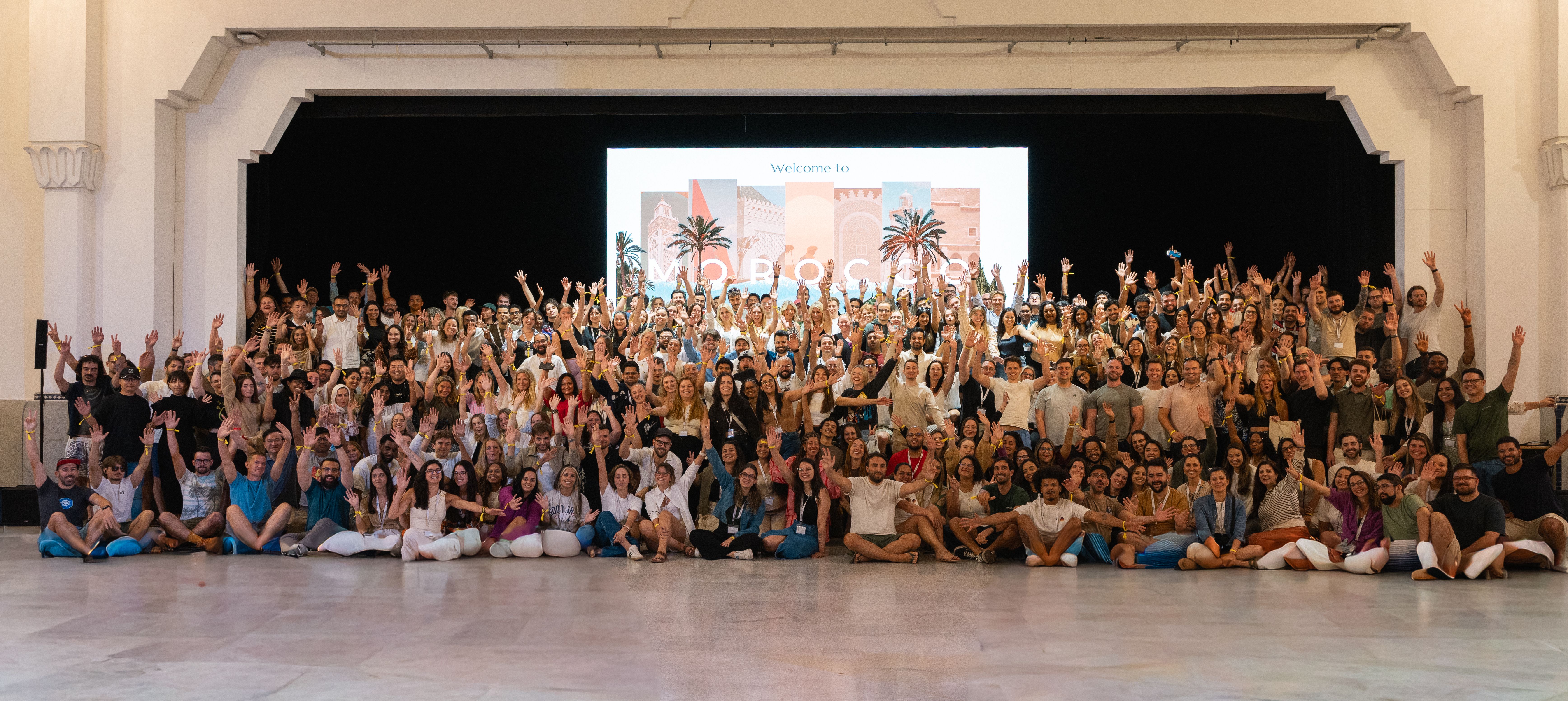 Voy team with their hands up in the air