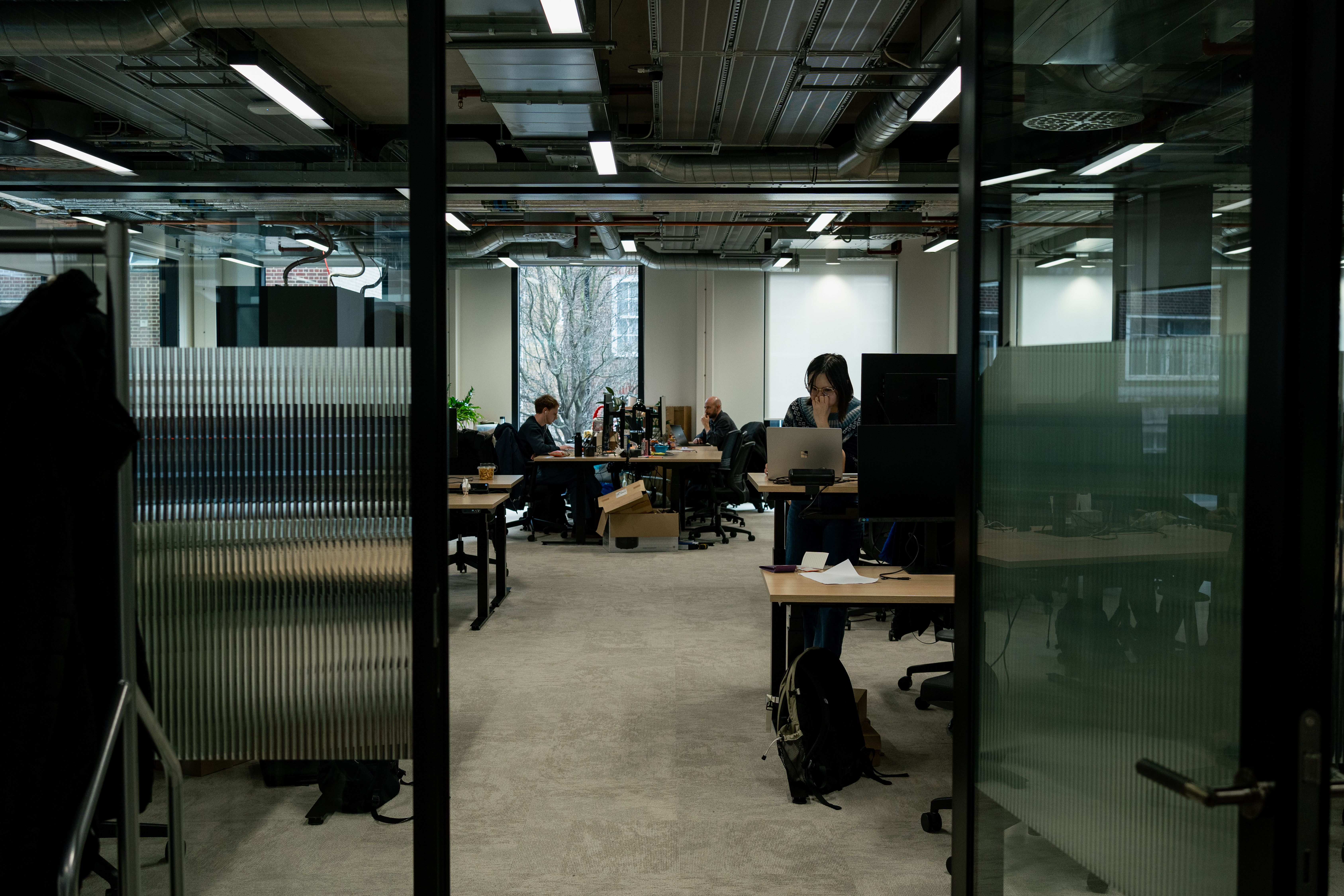 People working at desks in the Voy office