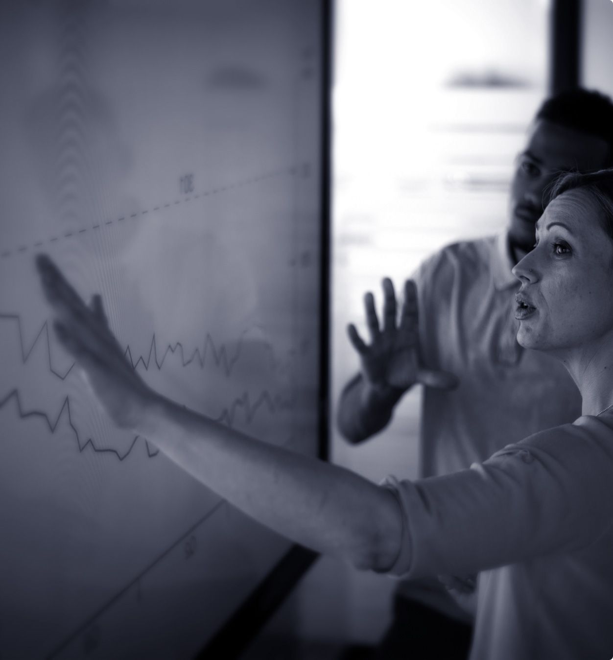 Colleagues reviewing performance data from omnichannel marketing campaign.