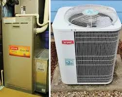 An aging indoor furnace next to an outdoor Bryant air conditioning unit