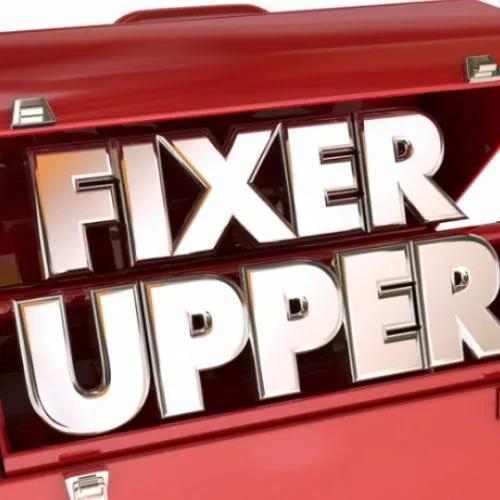 Red toolbox with the words "Fixer Upper" in metal letters