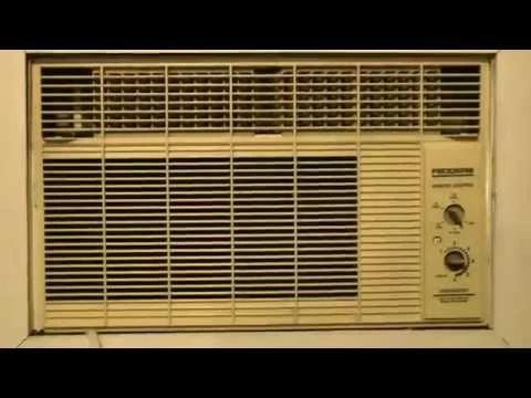 Old beige window air conditioner