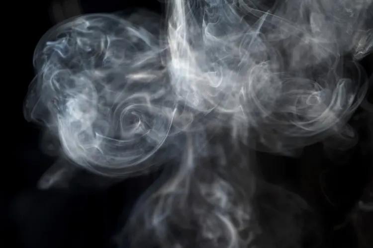 Swirl of white smoke against a black background