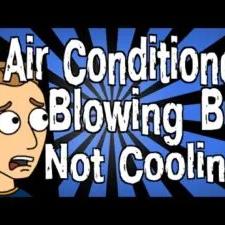 Cartoon of a worried man with the words "Air Conditioner Blowing But Not Cooling!"
