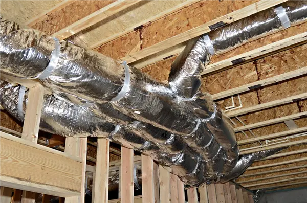 Insulated flexible ductwork running through an unfinished attic