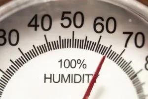 Close-up of a humidity gauge with the needle near 60 percent