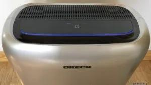 Oreck portable air purifier on a wood floor