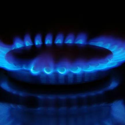 Blue flames on a gas burner in the dark
