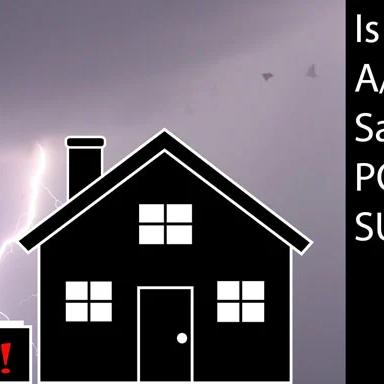 Silhouette of a house under a lightning strike with the words "Is your A/C unit safe from power surges?"