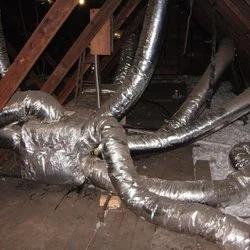 Tangle of insulated flexible ducts in an attic