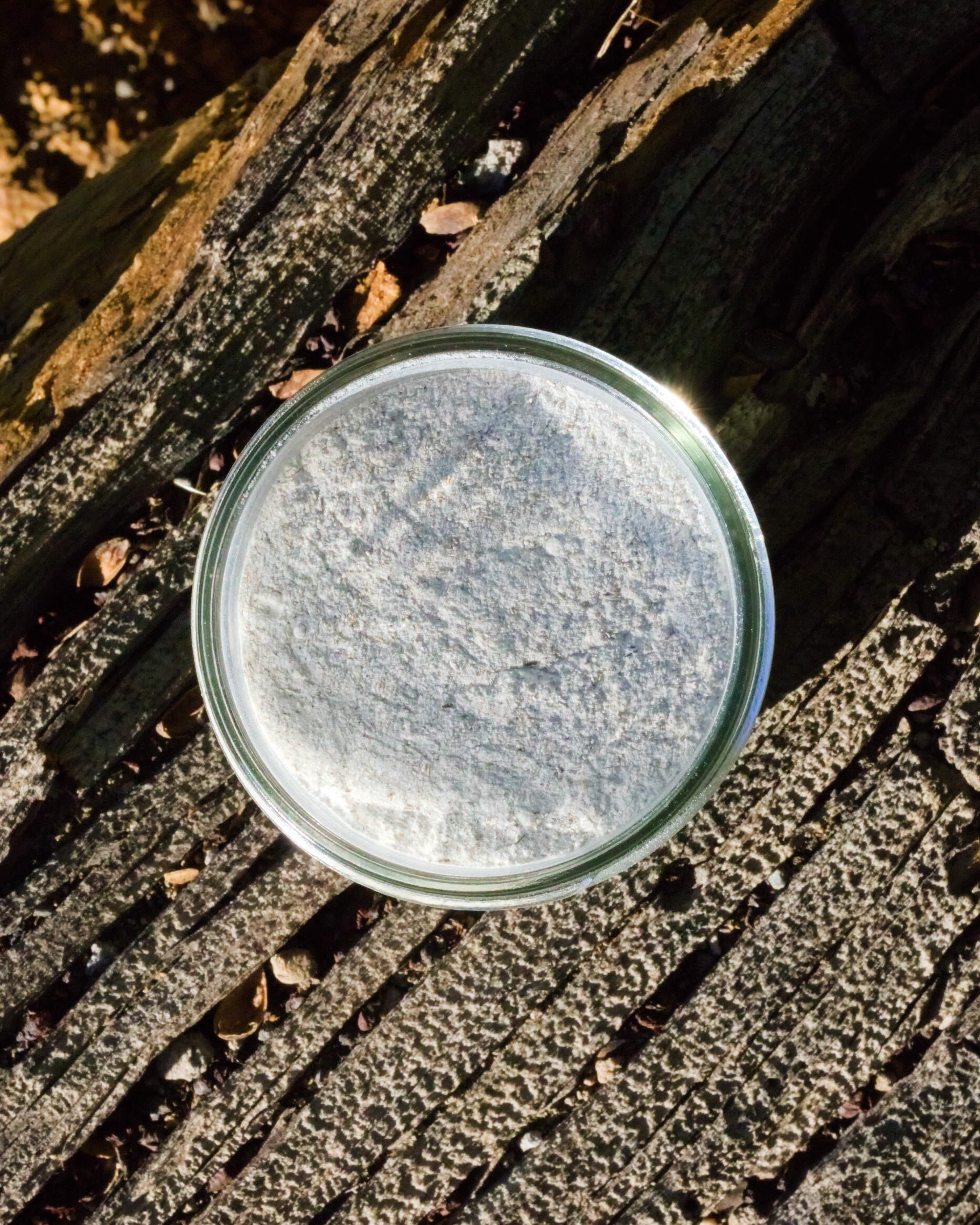 Irish Mist Beard Mask and Facial Scrub surrounded by ingredients