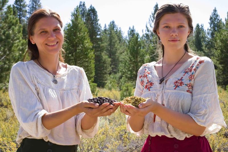 Herbalists Jessica and Evelyn Kelly holding herbs