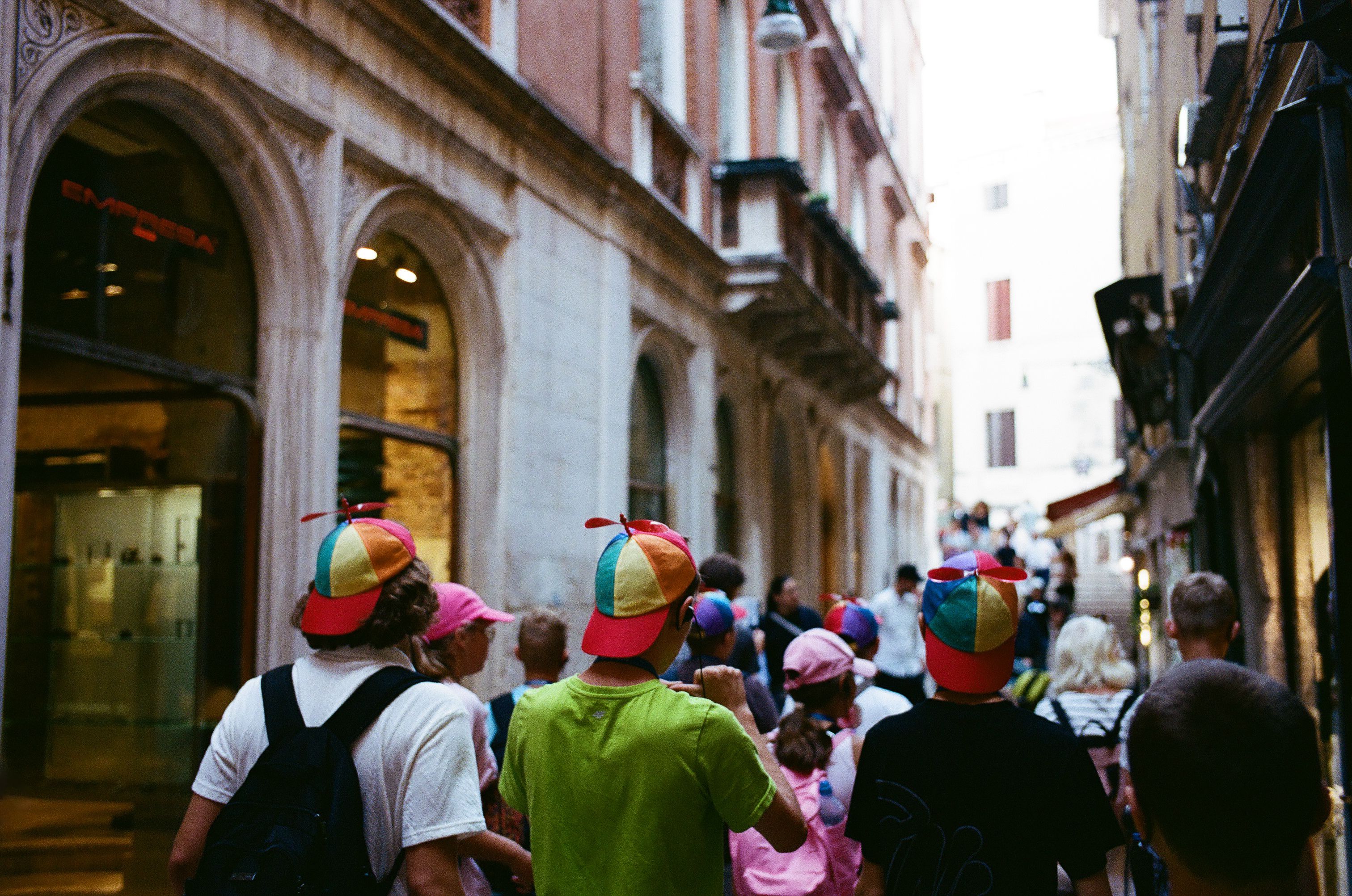 An unexpected procession of colours in a narrow Venetian street.