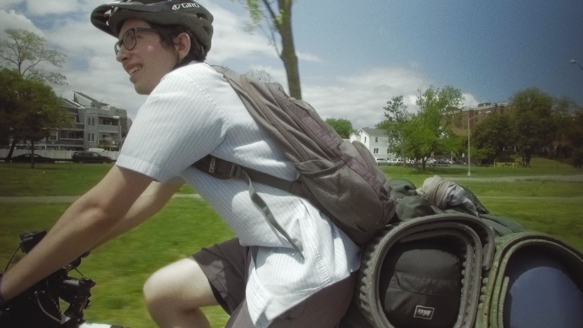 Koby cycling along a road