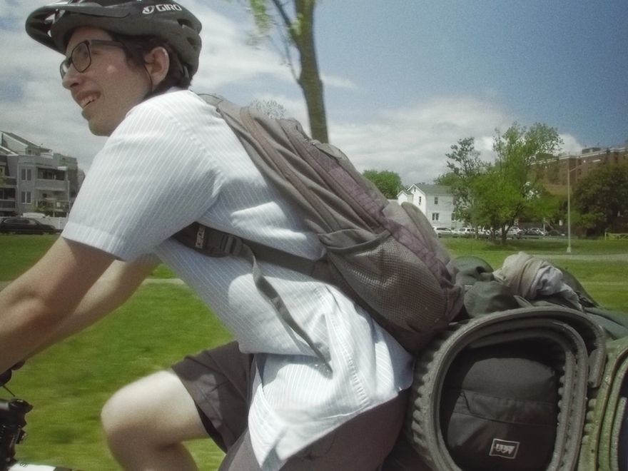 Koby cycling along a road