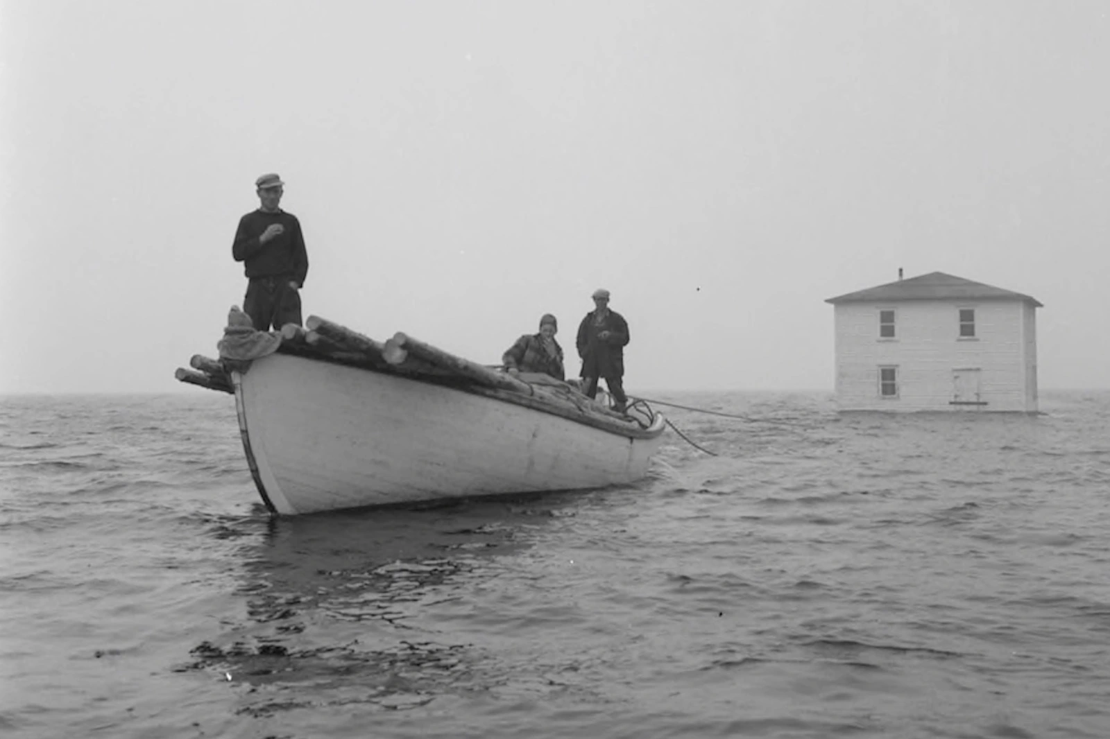 A old photograph of three sailors.