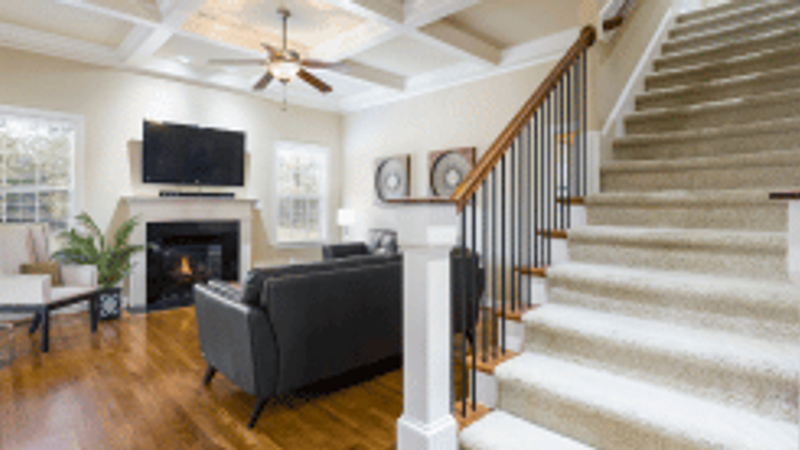 Living Room with Stairs Design