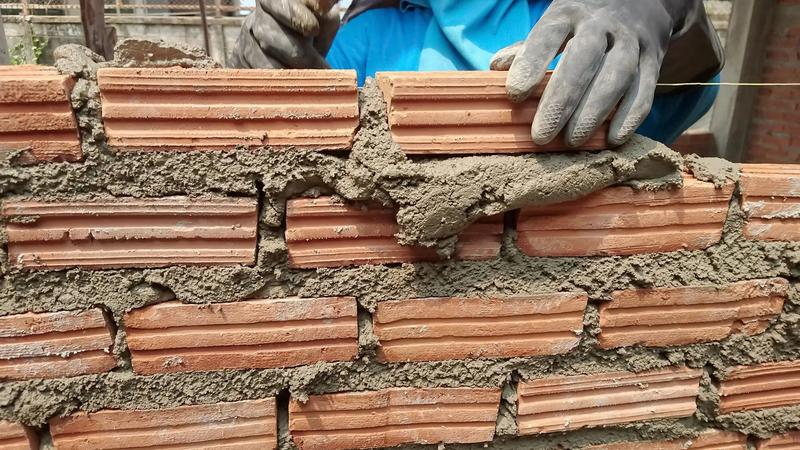 Single brick walls used for interior partitions, room separation, boundary walls, and lightweight construction projects.