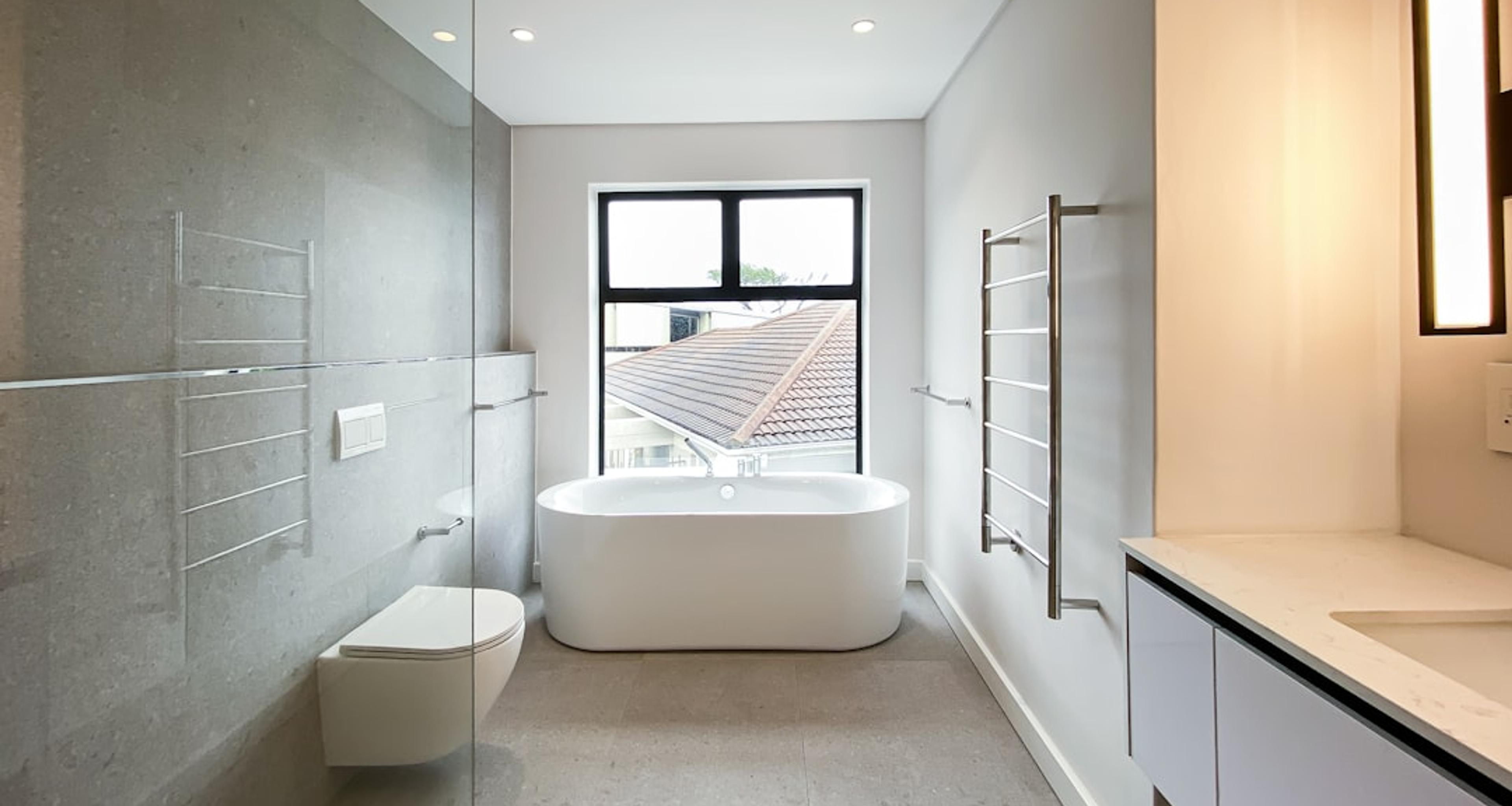 Bathroom with freestanding tub and glass walk-in shower