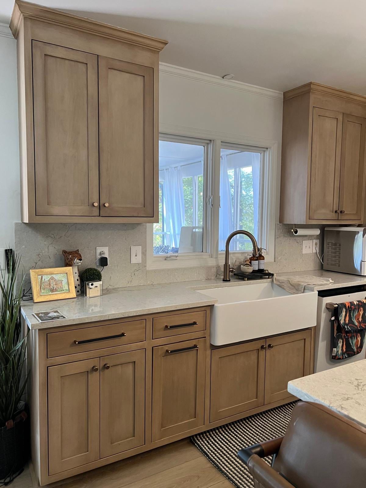 Light wood shaker kitchen with farmhouse sink