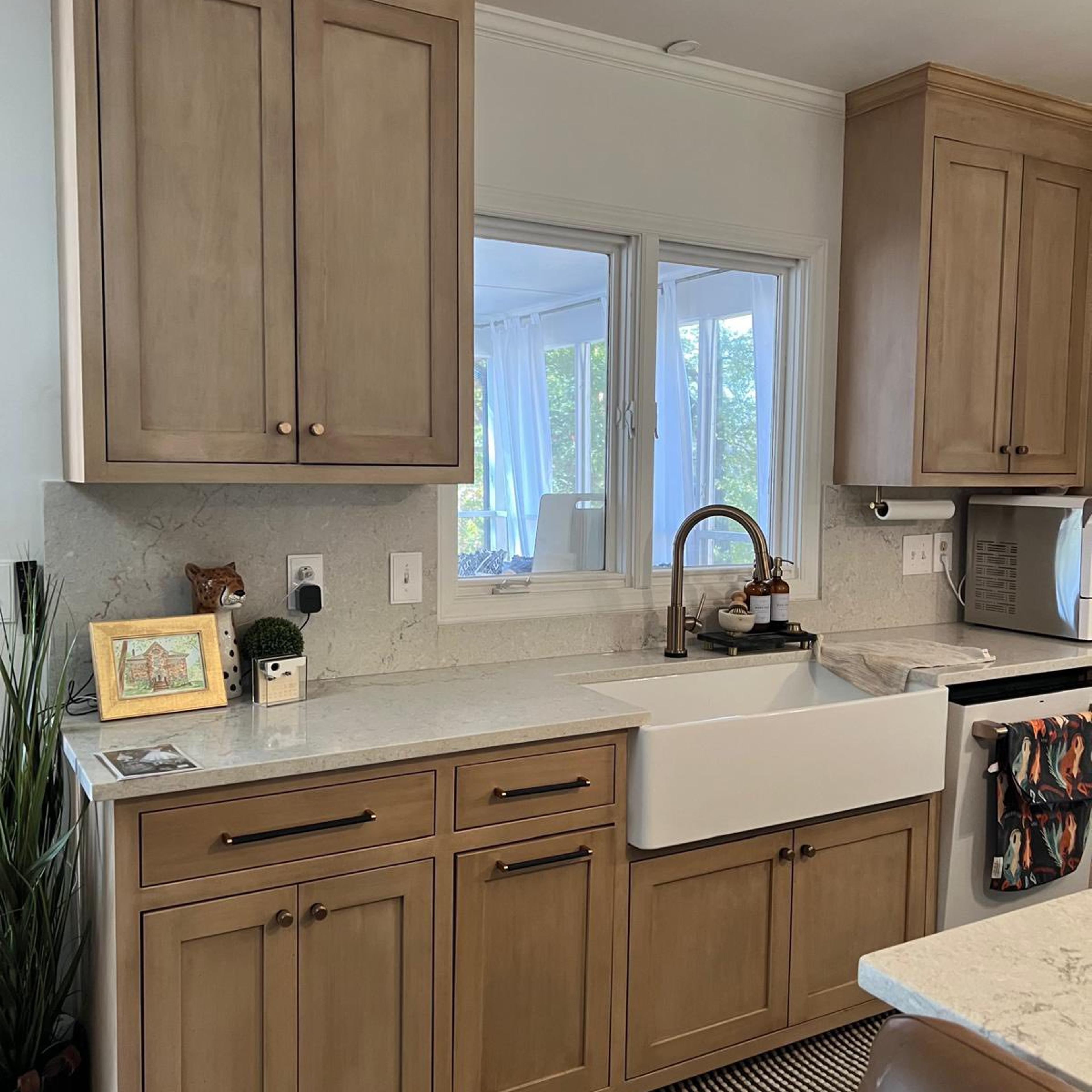 Light wood shaker kitchen with farmhouse sink