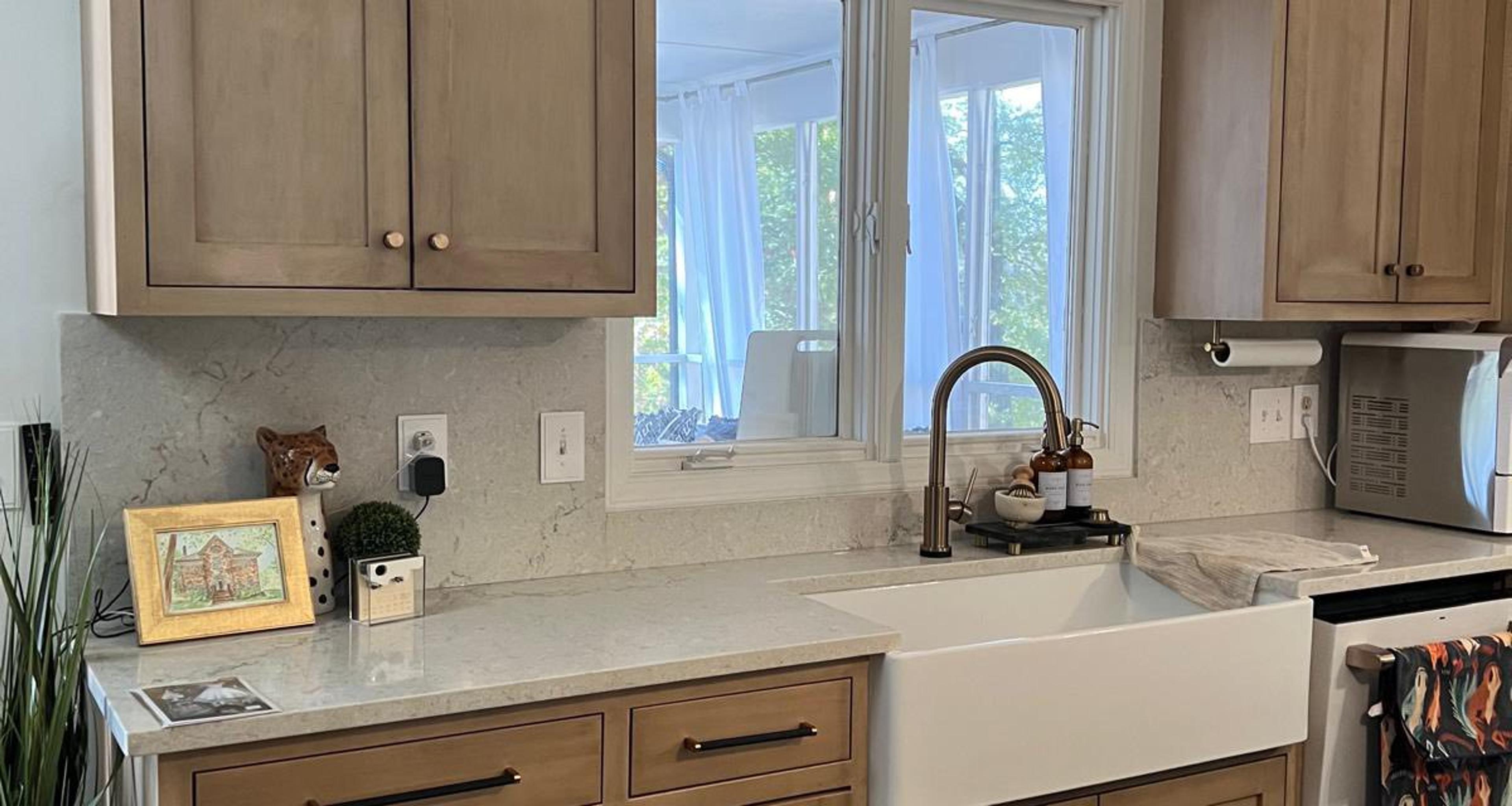 Light wood shaker cabinets with farmhouse sink