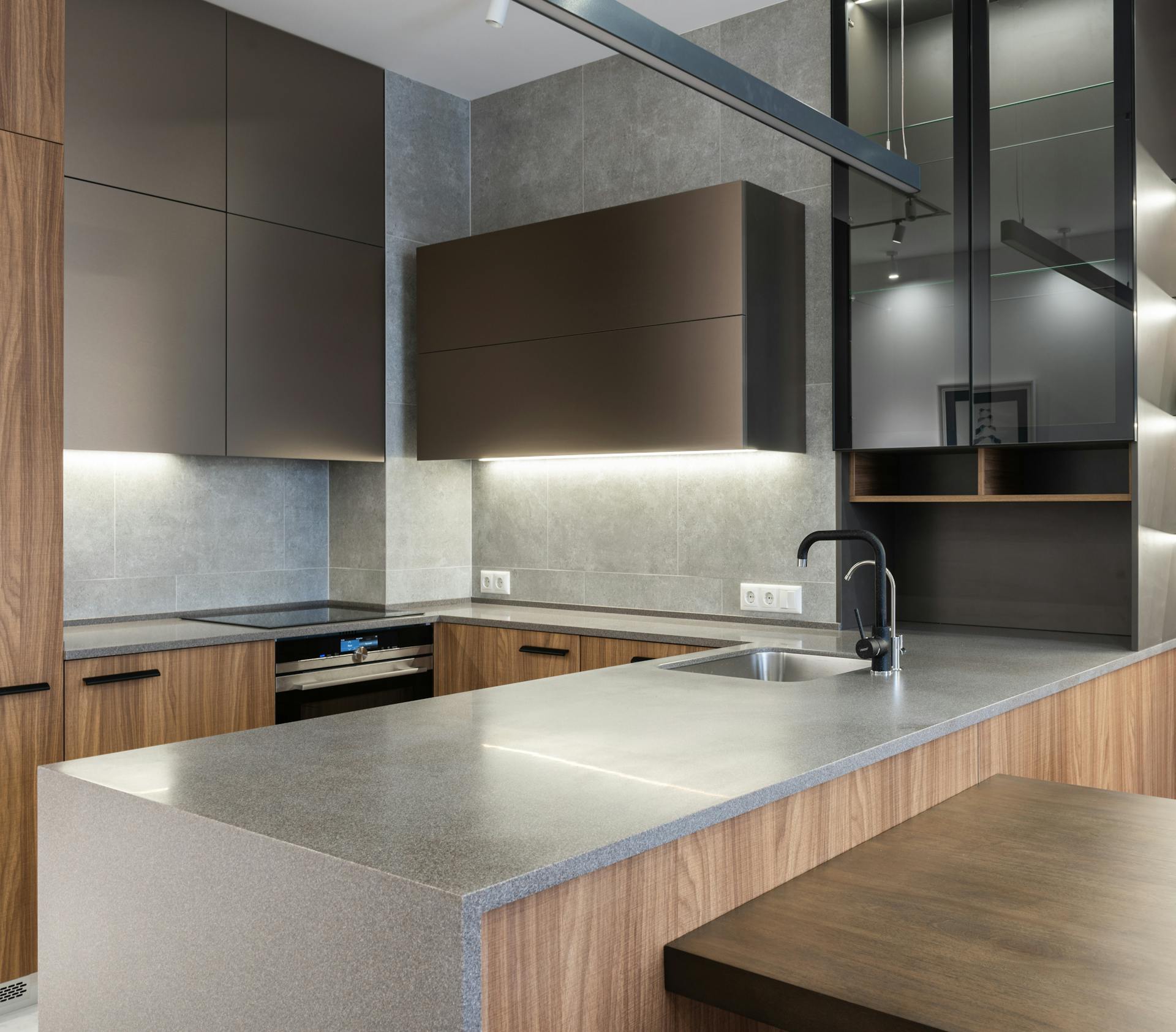 Modern walnut and concrete kitchen by Regal Home Center
