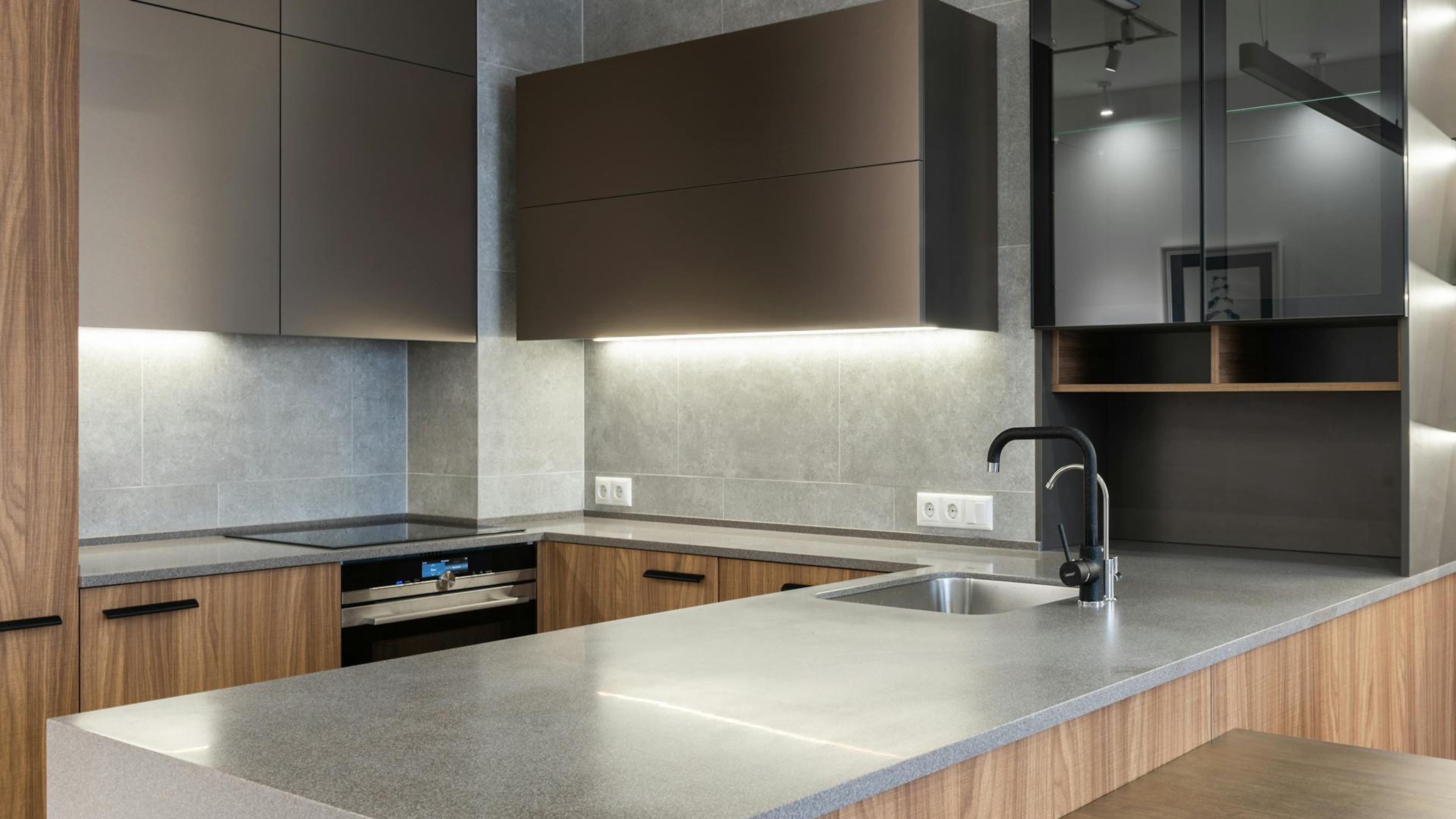 Modern walnut and concrete kitchen by Regal Home Center
