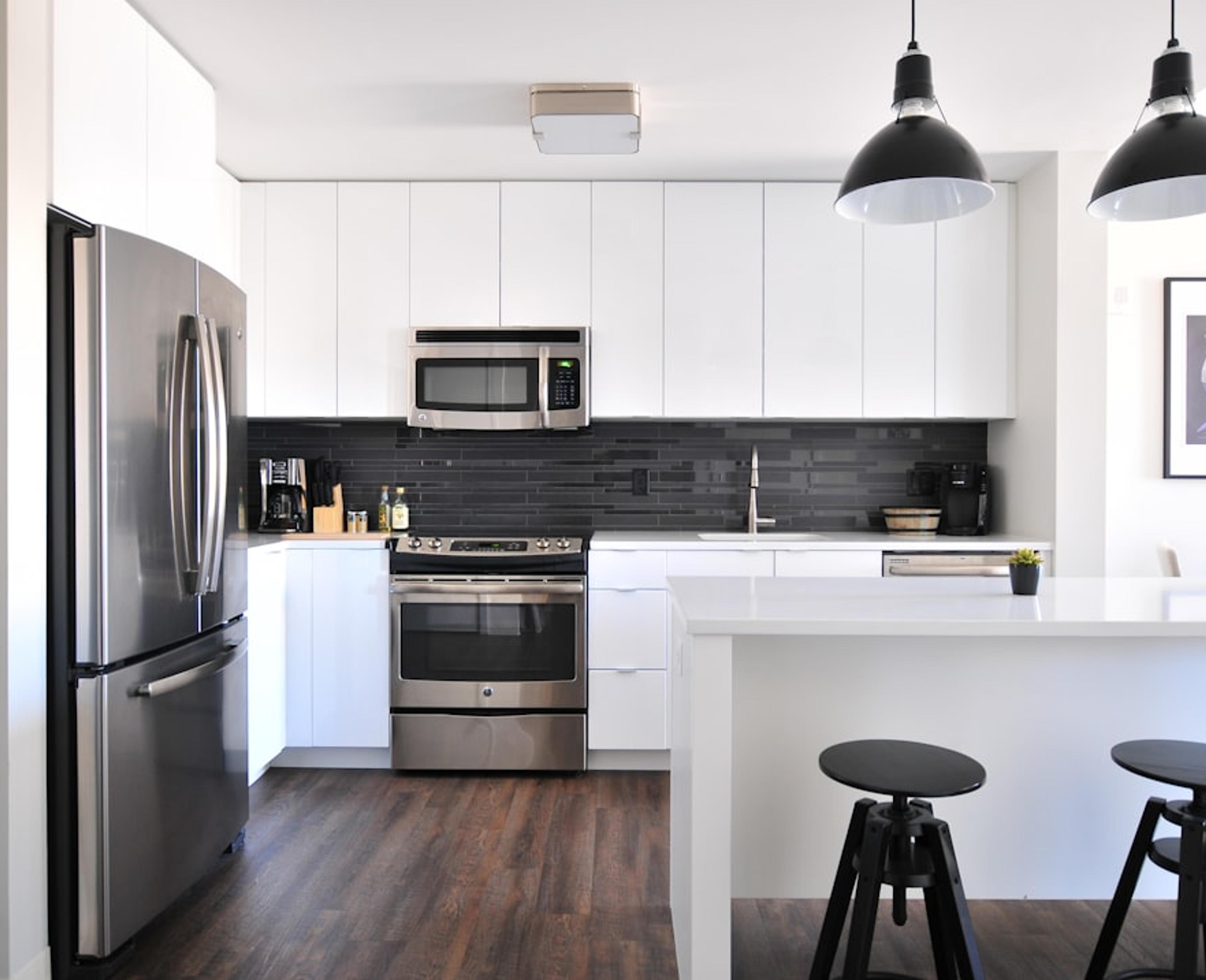 White kitchen with black accent wall