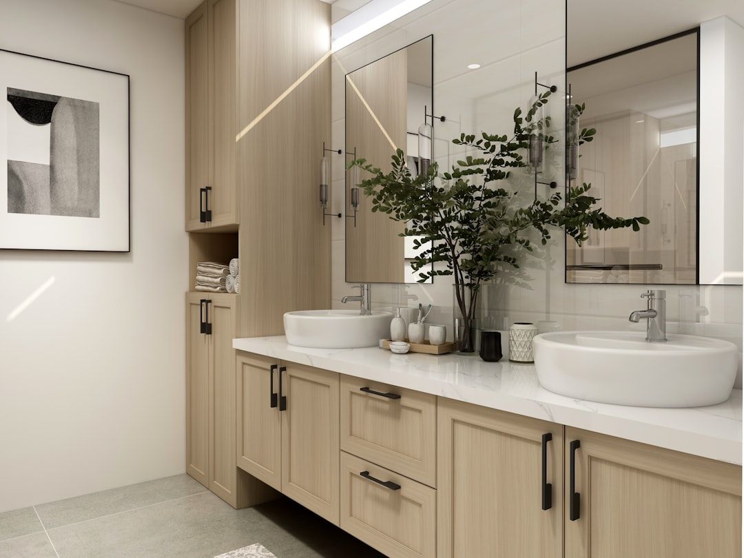 Double vessel-sink vanity in light wood with framed mirrors