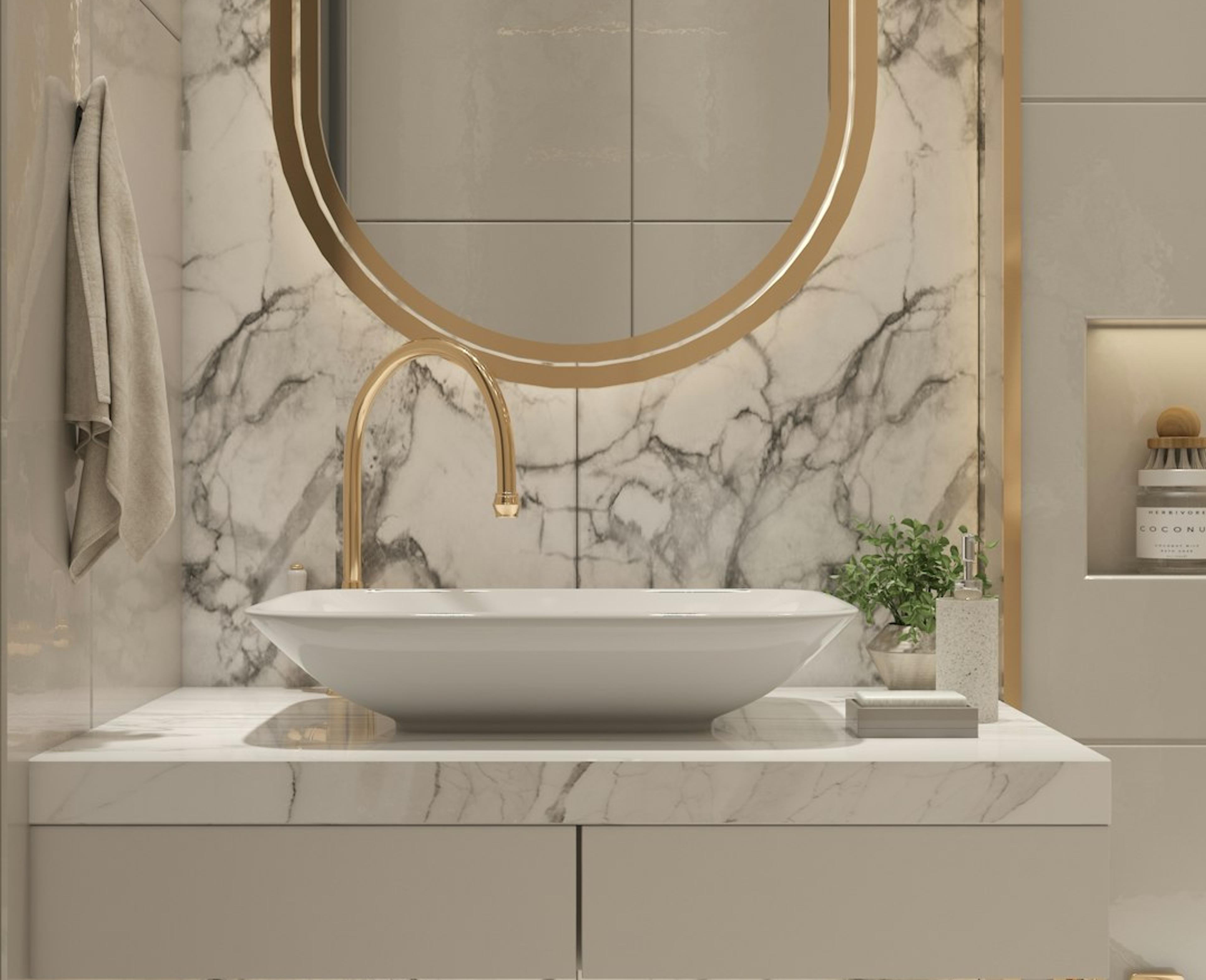 Gold-framed mirror and marble in luxury powder bath