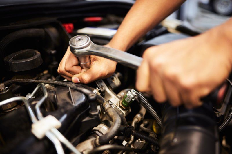 Mechanic checking engine