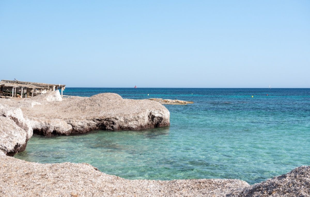 Wonderful turquoise water of Migjorn beach in Formentera in Spain.