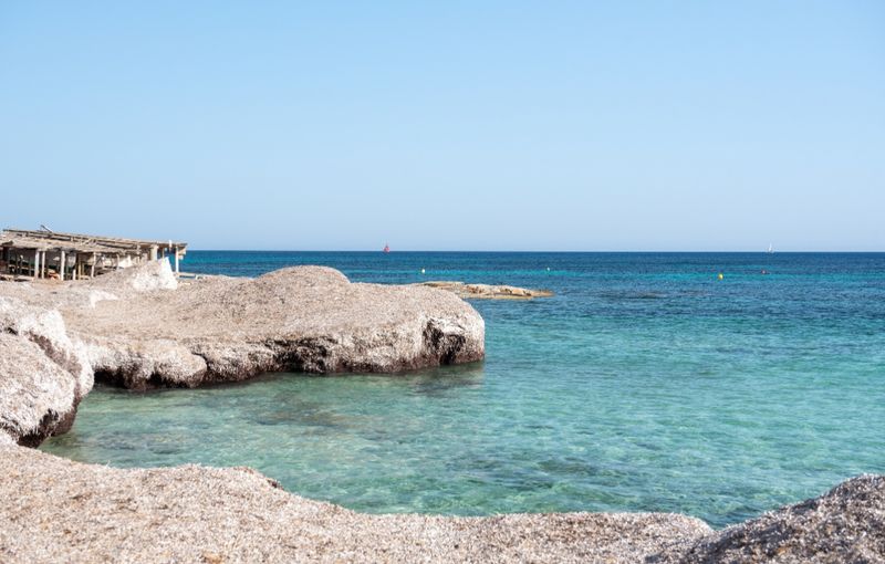 Wonderful turquoise water of Migjorn beach in Formentera in Spain.