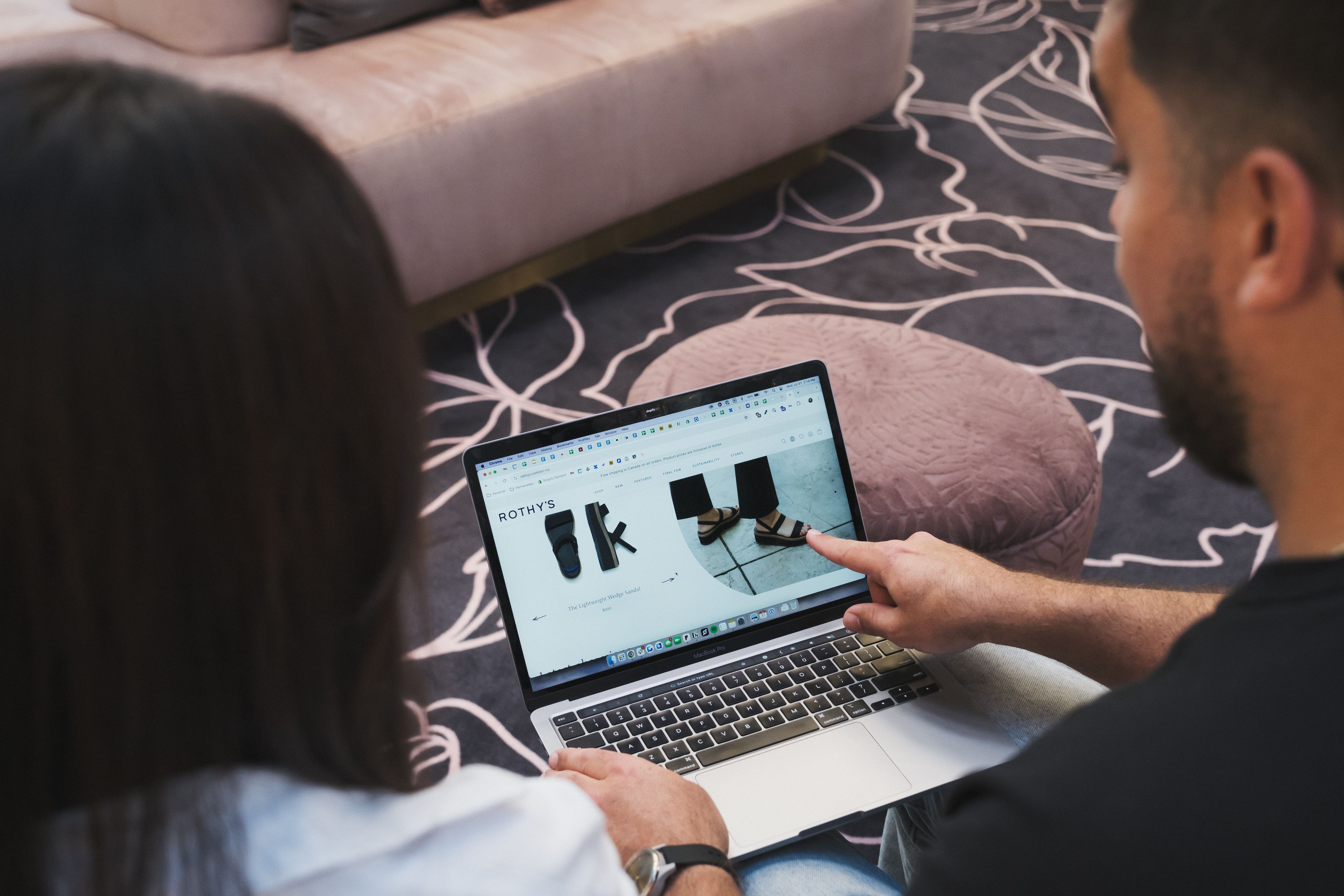 Finger pointing at laptop screen