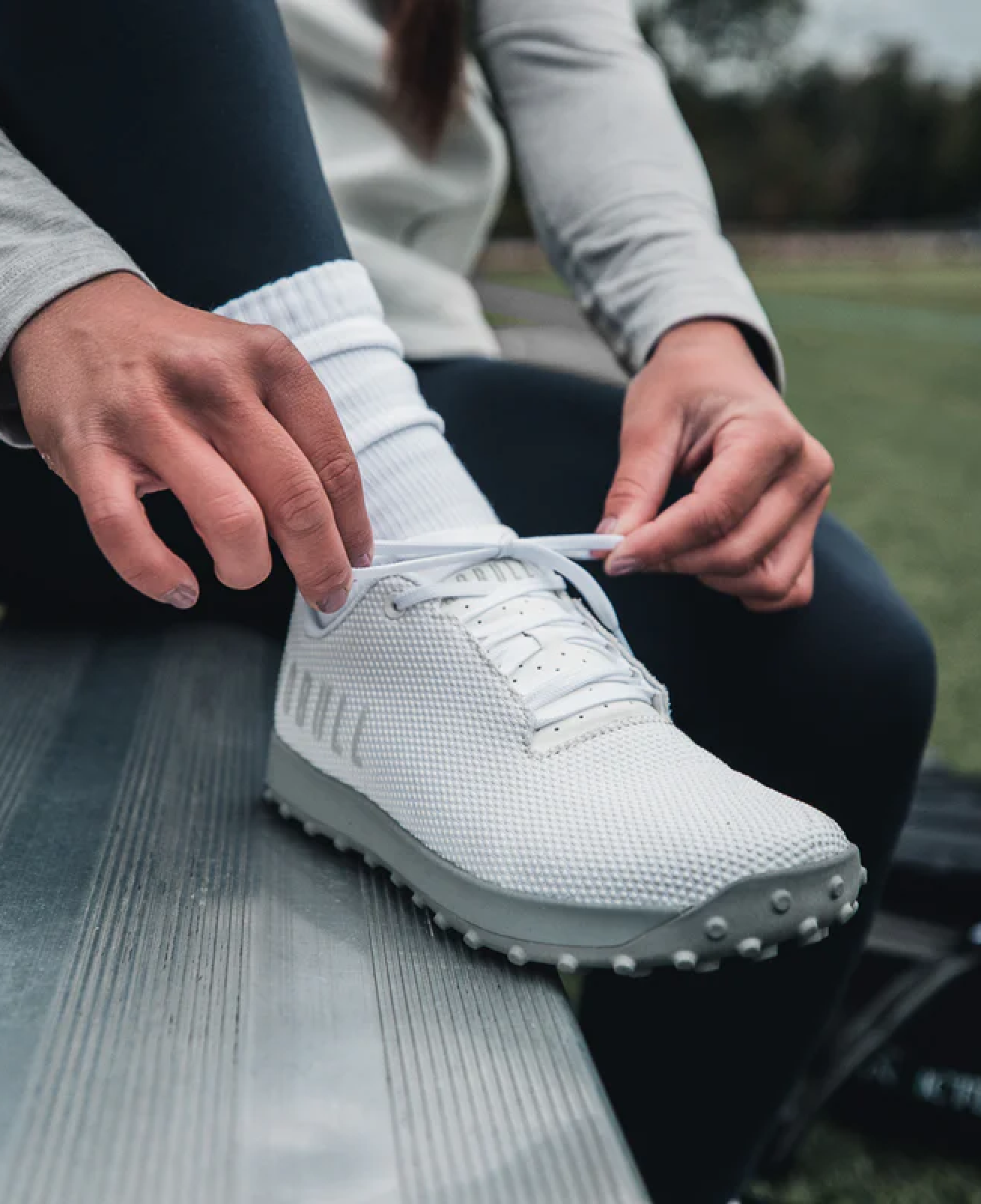 Image of a person tying their Nobull sneakers