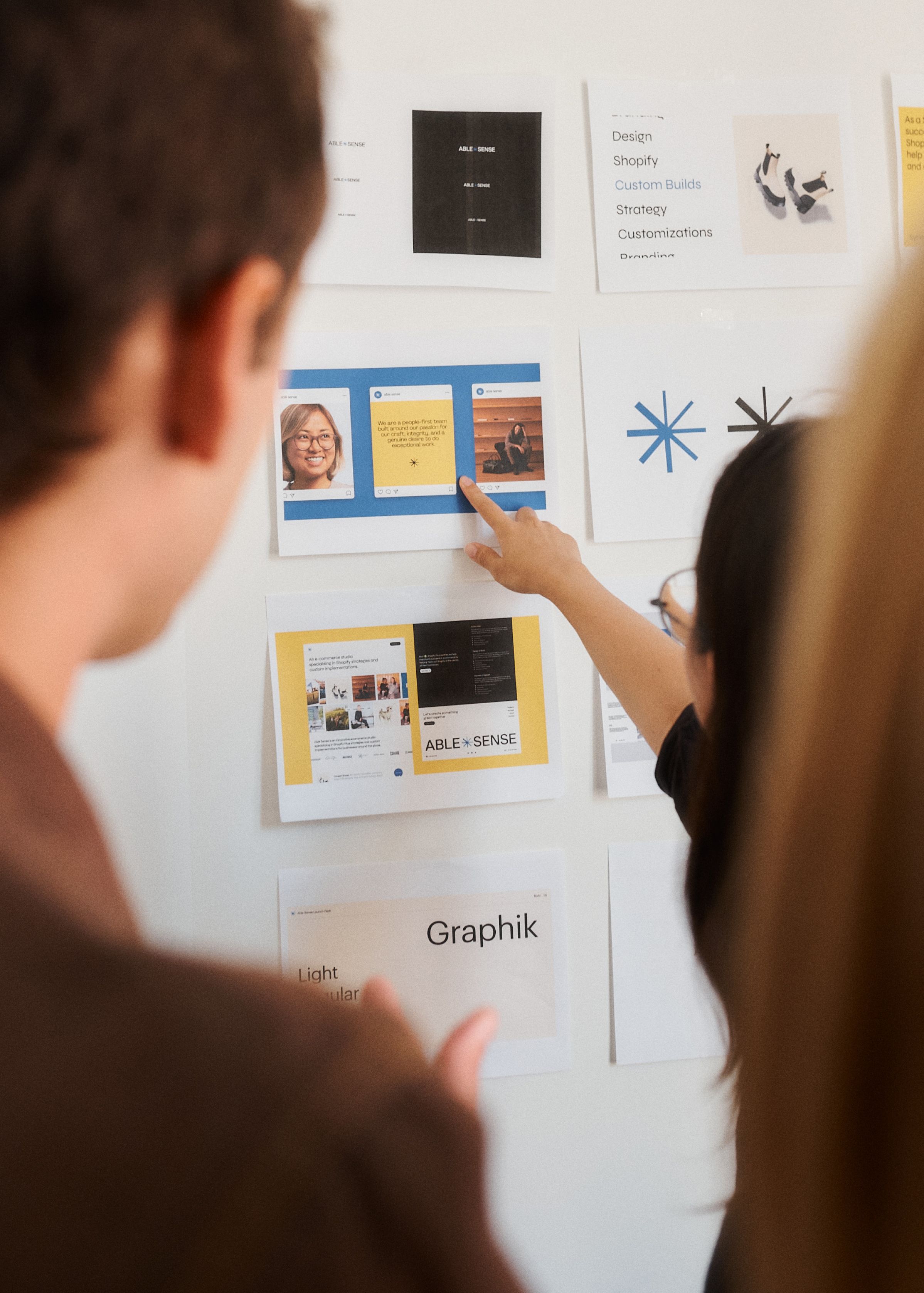 Team members gathered around moodboards