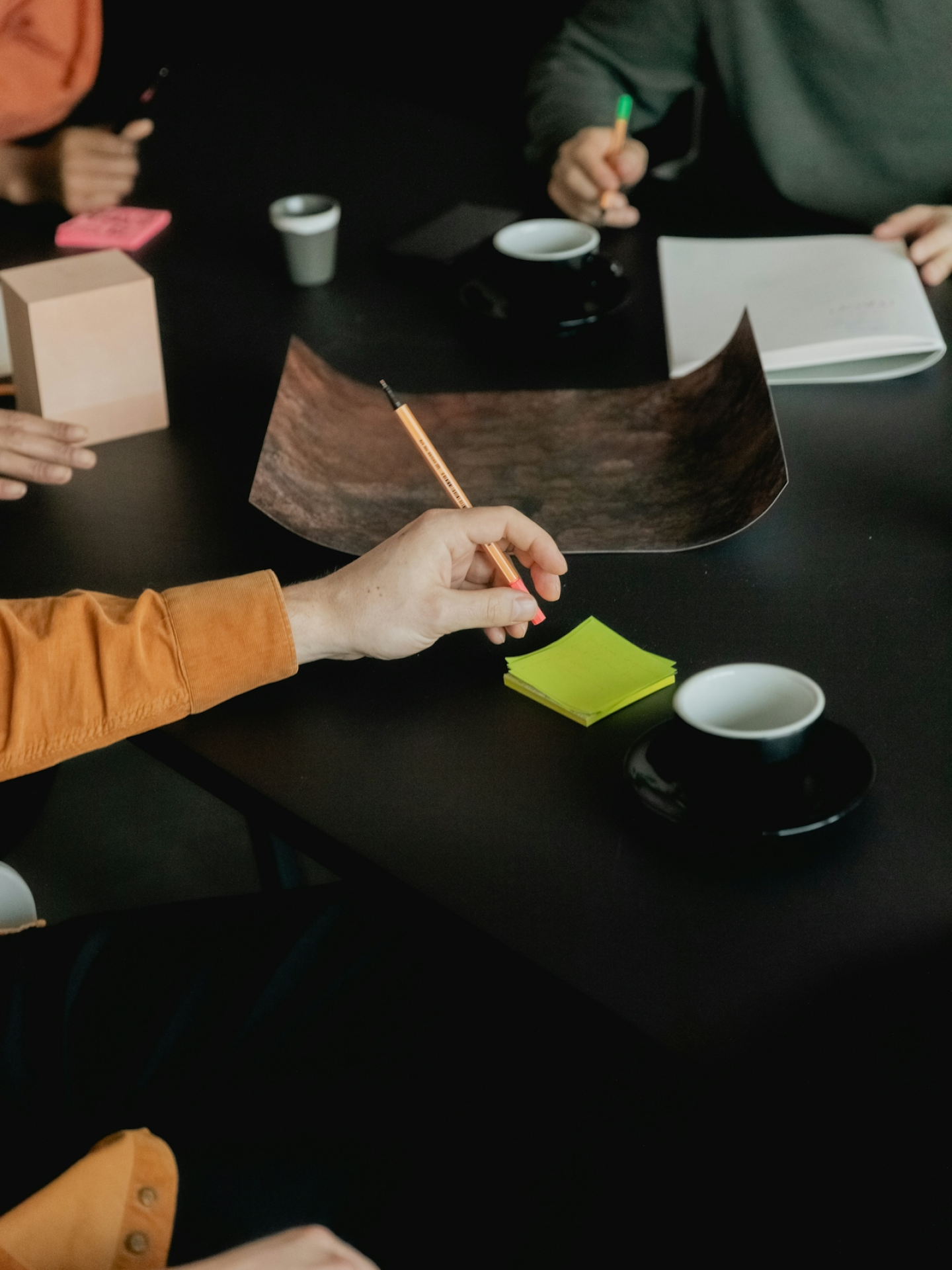 Hands of people working at a desk