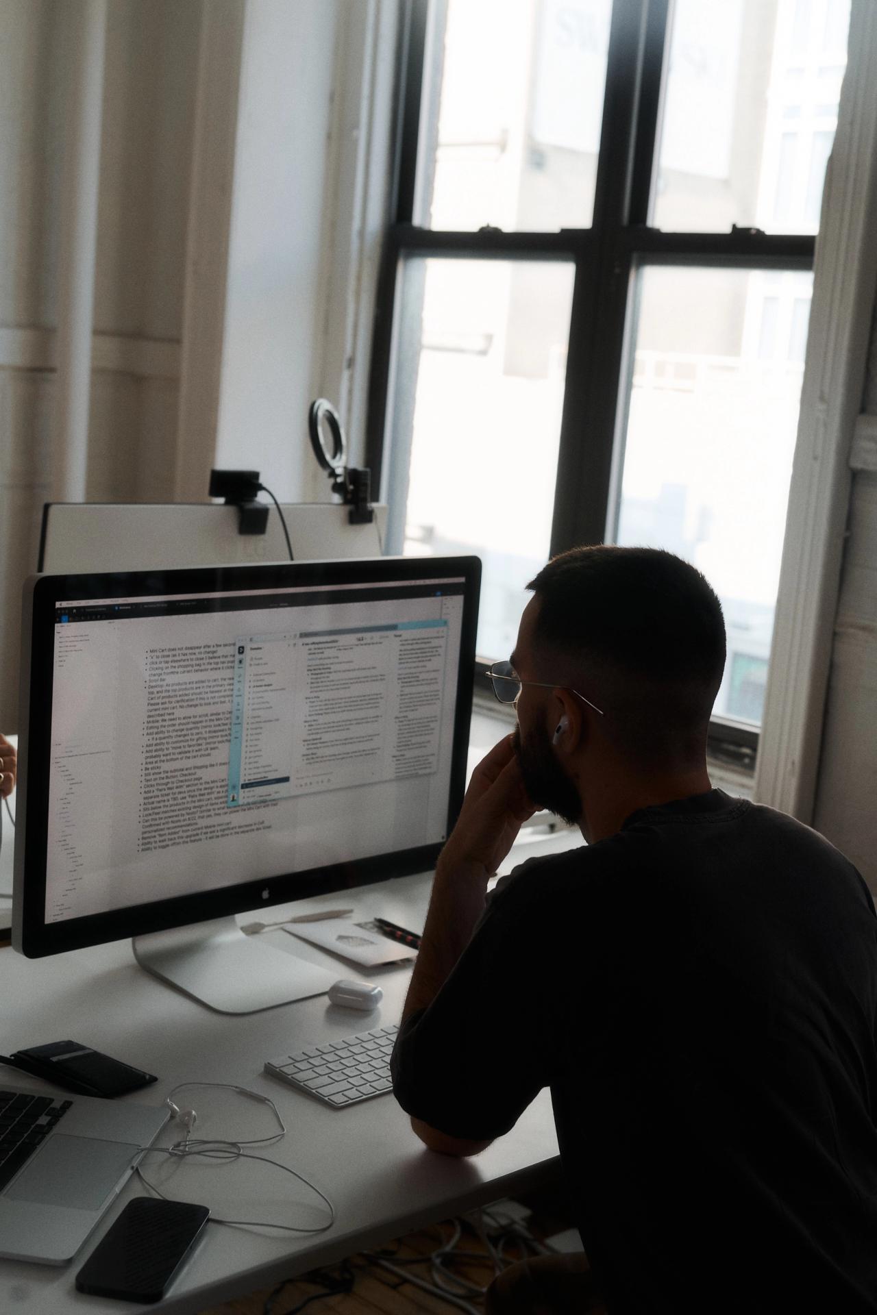 Paul working at his desk