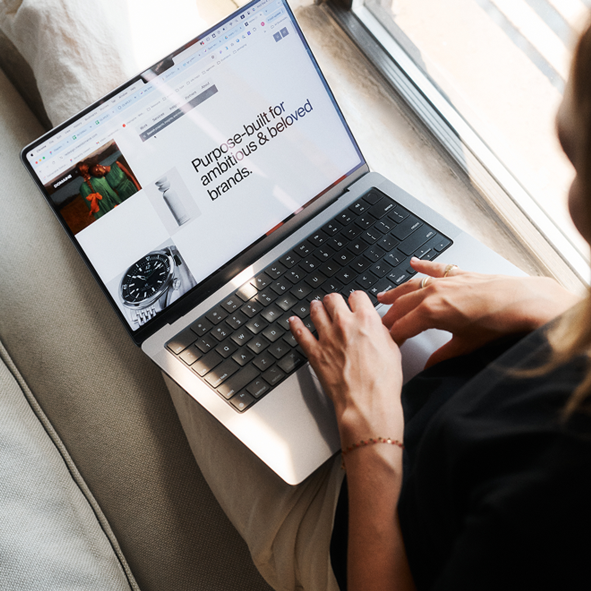 Lenora typing on a laptop