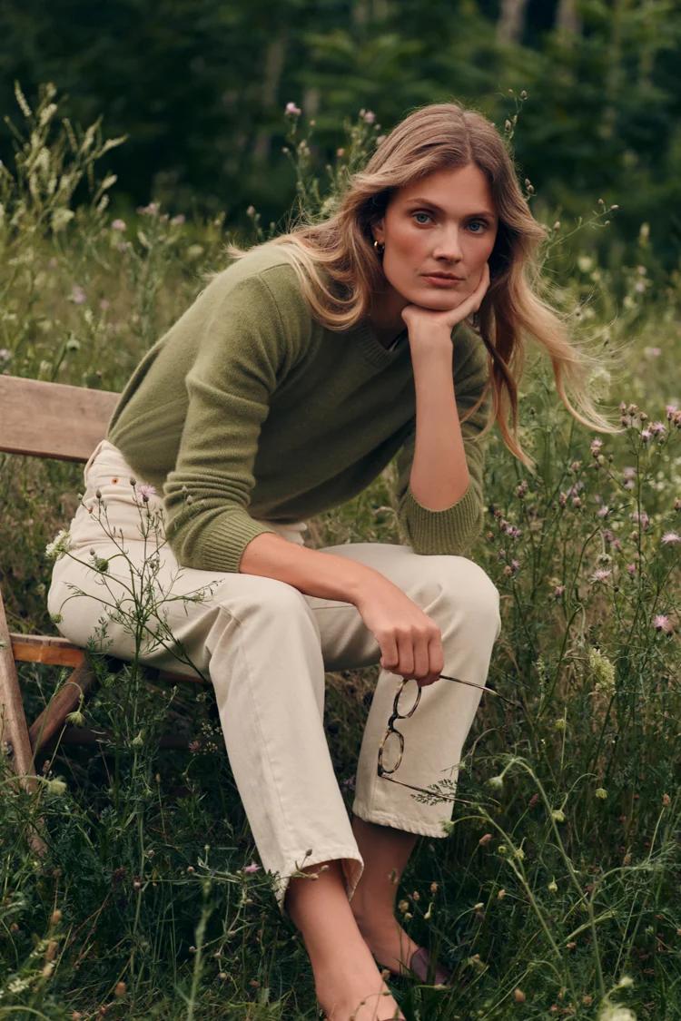 Model wearing beige pants and green top from Tuckernuck
