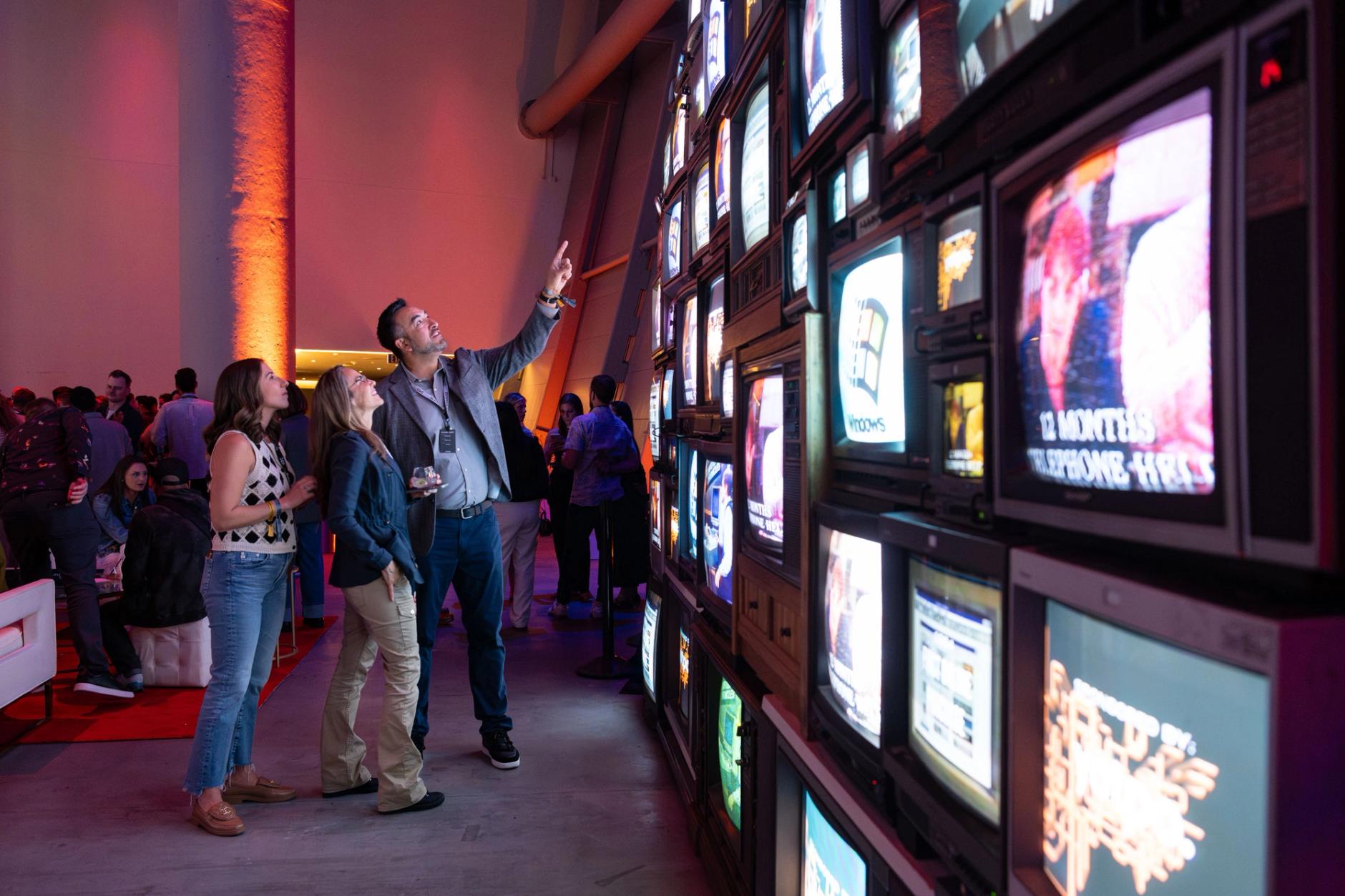 Guests looking at TV wall installation
