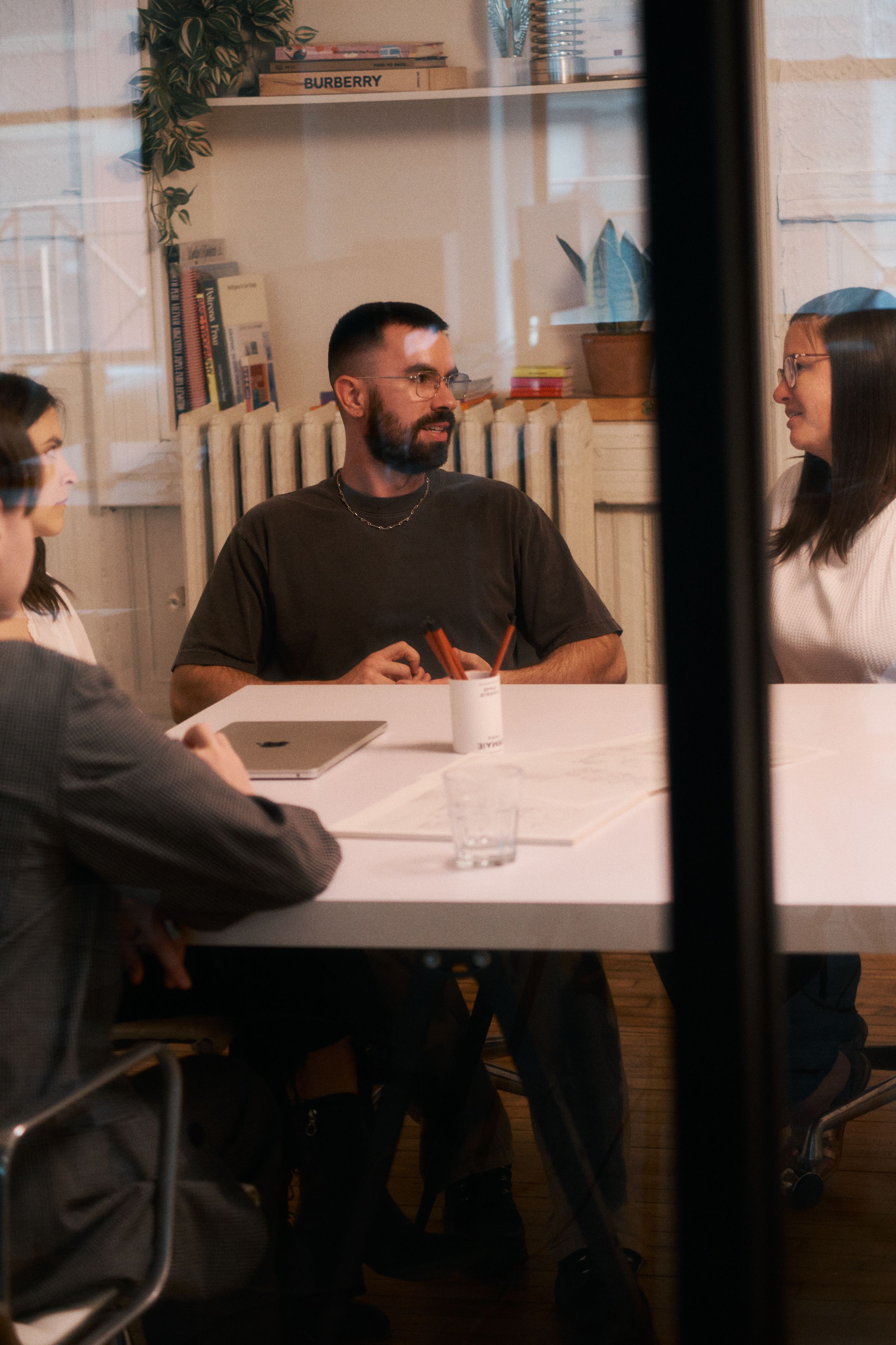 Team members gathered around conference table