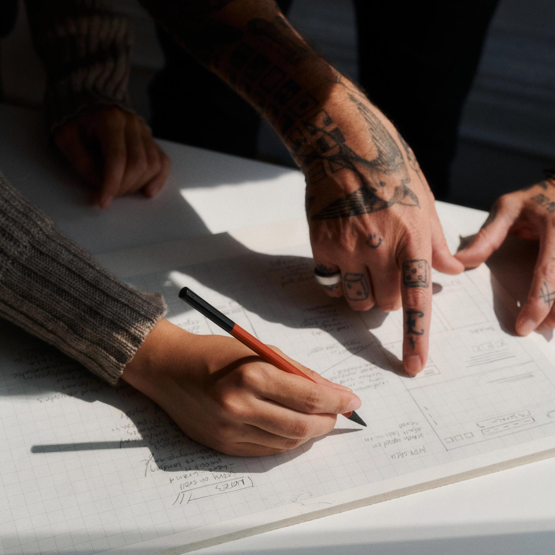 Marko and Sarah working on wireframes for a website