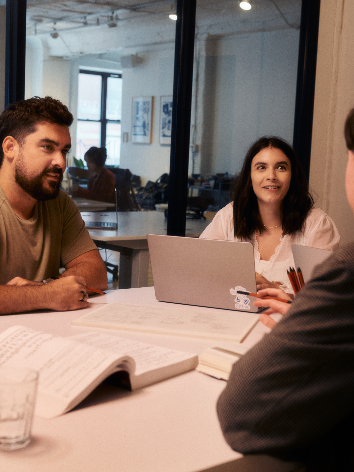 A team sat around a table talking