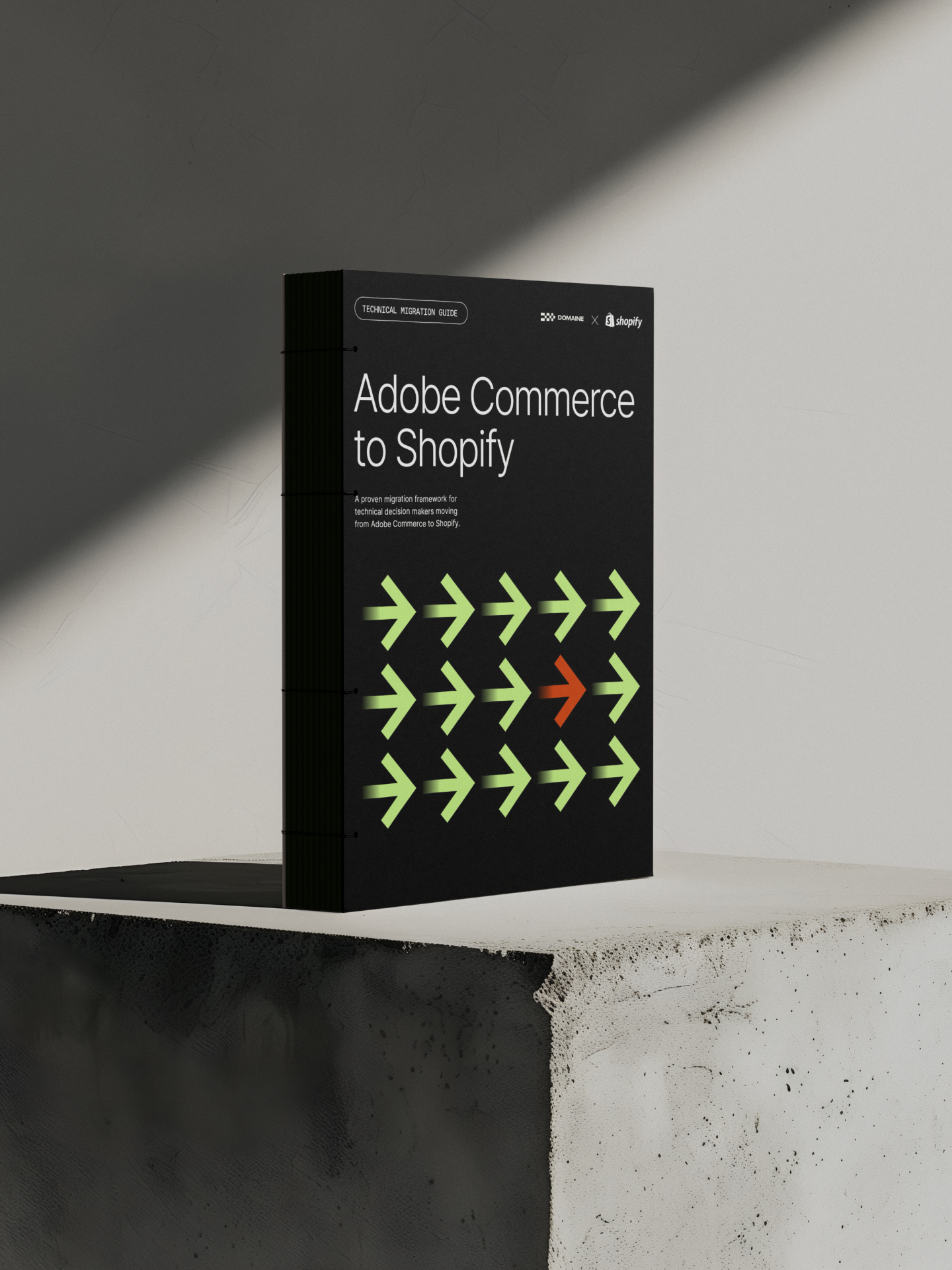 Mockup of Adobe migration guide on a grey background and cement block